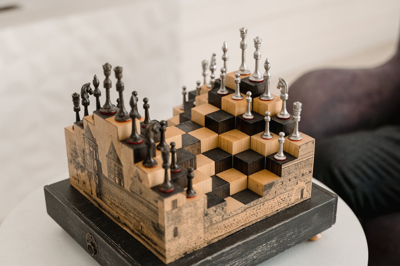 our-services-1 Artistic chess set with 3D pieces on an intricate wooden board indoors.